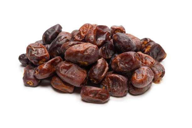 Dried dates isolated on white background. top view.