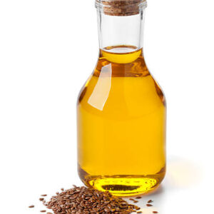 Bottle of flax seed oil ans seeds on white background